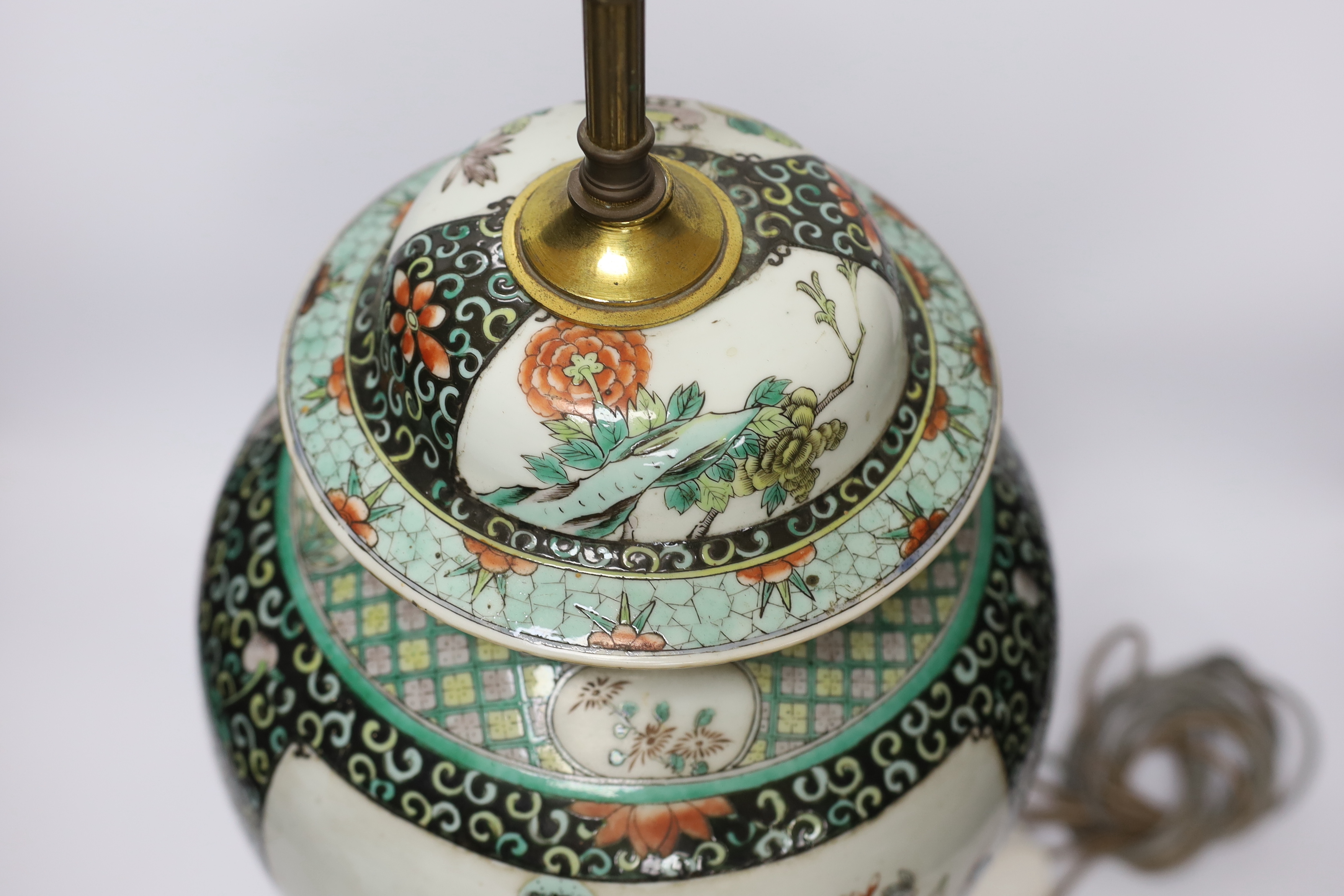 A Chinese famille verte porcelain baluster vase and cover, 19th century, decorated with birds amongst branches and blossom on decorative gilt metal base (now converted to a table lamp and drilled), 56cm total